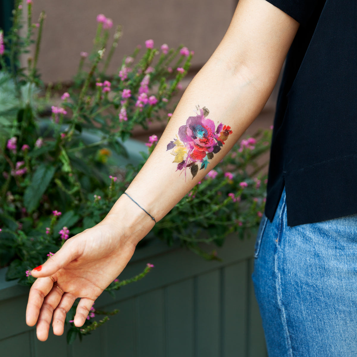 small flower wrist tattoo