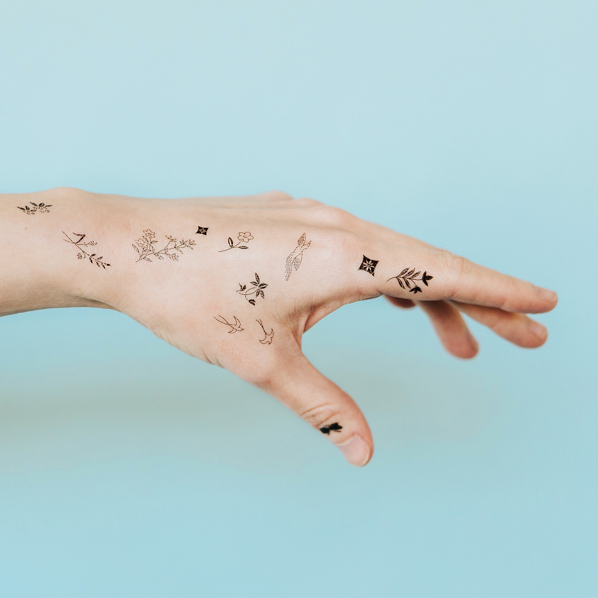 austin tott pairs tiny tattoos with parallel landscapes